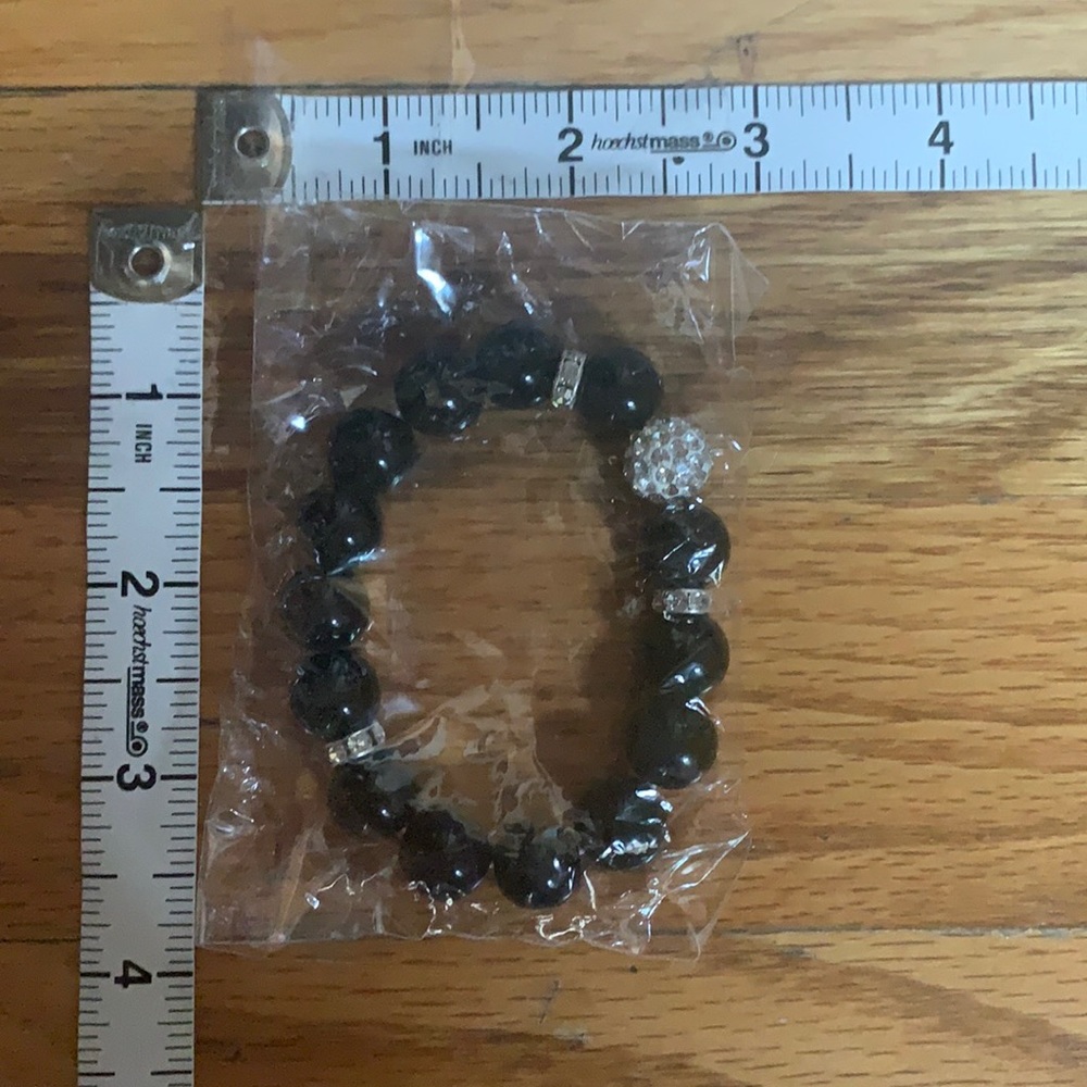 Simple black plastic beaded bracelet with crystal details